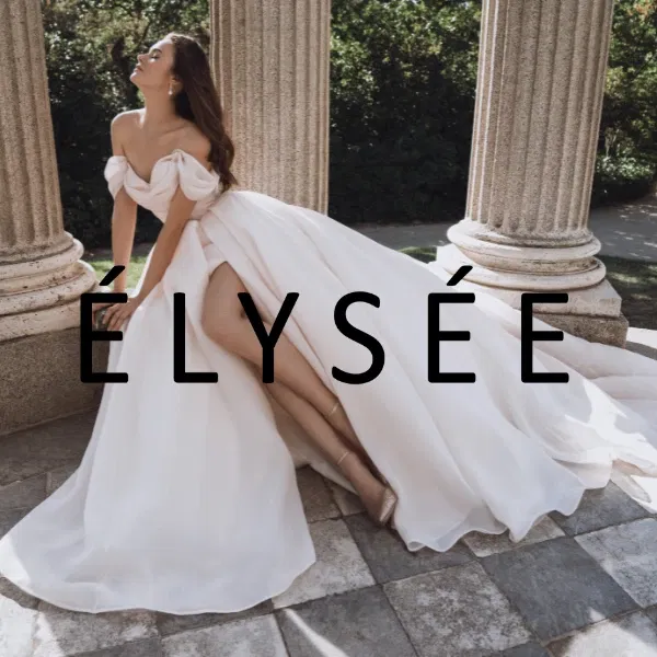 Banner von Elysee - eine Frau in einem ausladenden Brautkleid mit Beinschlitz sitzt auf einem kleinen Vorsprung zwischen Säulen.