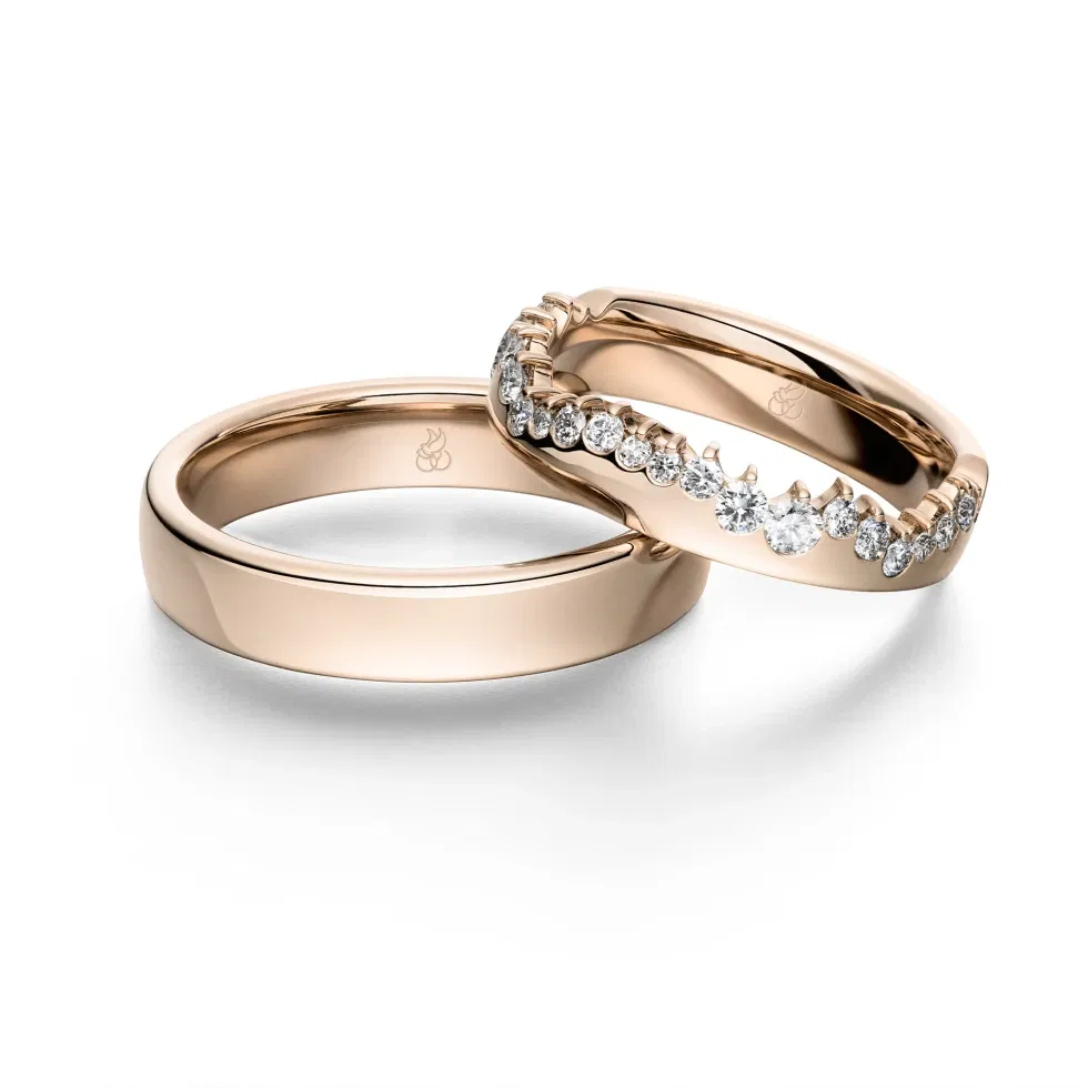 Elegante Eheringe aus Roségold mit funkelnden Diamanten aus der Polaris-Kollektion.